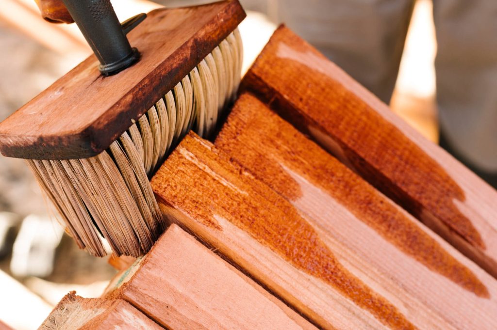 What is the difference between staining and sealing wood?